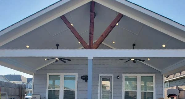 backyard porch installation with ceiling fans in hutto, tx